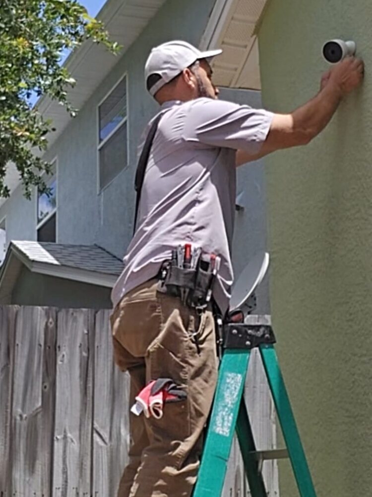 Master Communication International technician performing an organized low-voltage installation